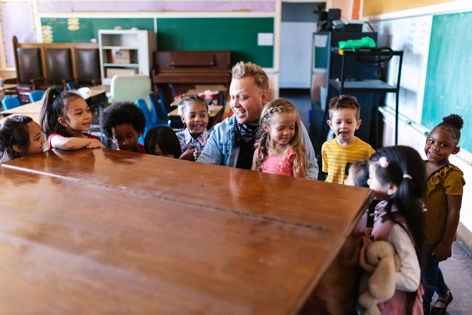 Kindergarten children gathered around a teacher, engaging in cheerful learning activities in a vibrant classroom